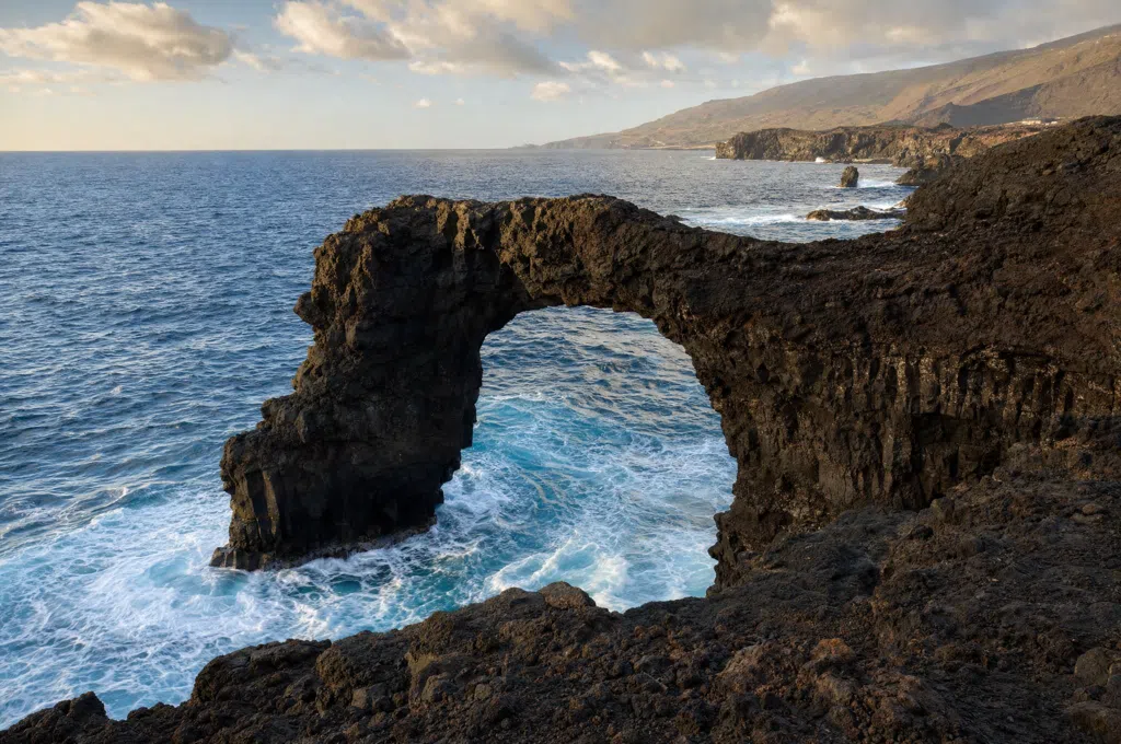 Natural lava rock arch on the coast of El Hierro
